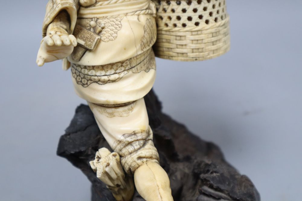 A Japanese Meiji ivory figure of a fisherman, height 26cm